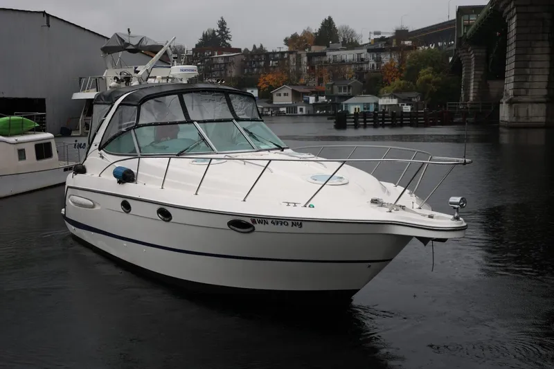Slide: The Image of 2005 Maxum 3300 SE boat docked on a calm, overcast day. - 5