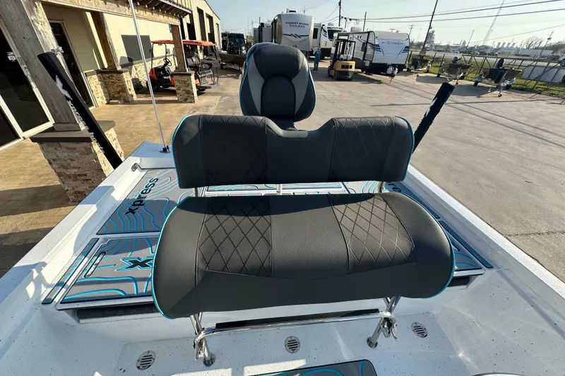 Slide: The Image of 2026 Express H22B boat seat with stylish black upholstery and blue accents. - 18