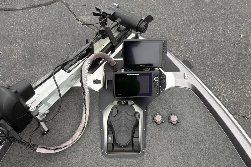 Slide: The Image of 2021 Skeeter ZXR20 boat dashboard with Garmin and Humminbird displays. - 12