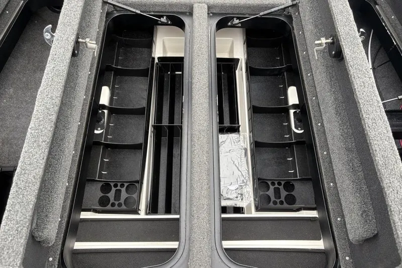 Slide: The Image of 2021 Skeeter ZXR20 boat storage compartments with organized rod holders and tackle storage. - 18