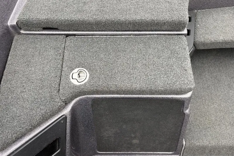 Slide: The Image of 2021 Skeeter ZXR20 boat deck with storage compartment and latch. - 21