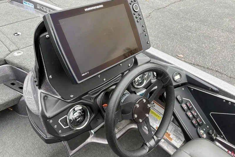 Slide: The Image of 2021 Skeeter ZXR20 boat dashboard with Humminbird Helix 12 fishfinder and steering wheel. - 26