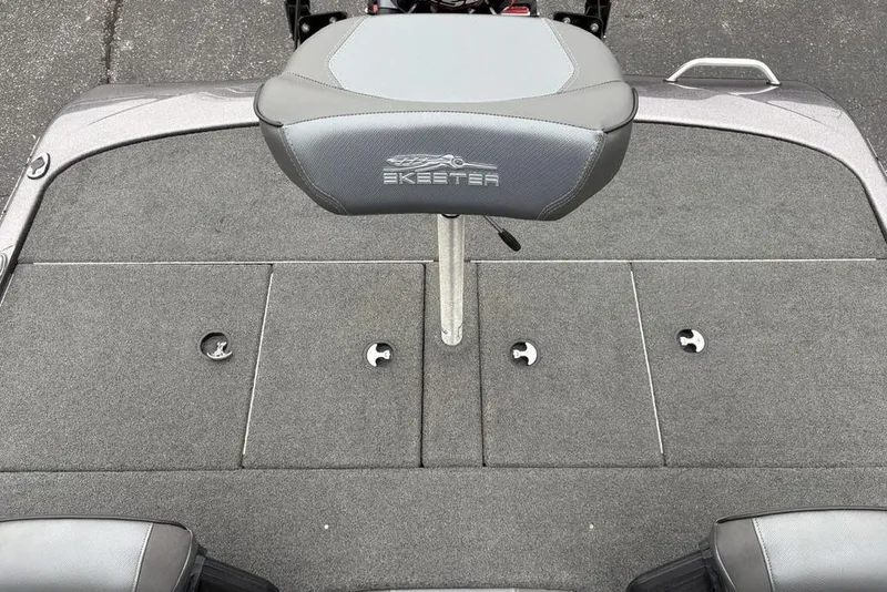 Slide: The Image of 2021 Skeeter ZXR20 boat deck with gray seating and storage compartments. - 30