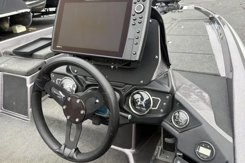 Slide: The Image of 2021 Skeeter ZXR20 boat dashboard with steering wheel and electronic display. - 31