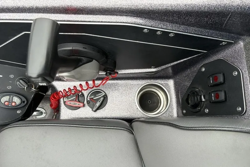 Slide: The Image of 2021 Skeeter ZXR20 boat console with controls and cup holder. - 34