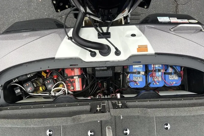 Slide: The Image of 2021 Skeeter ZXR20 boat battery compartment with wiring and equipment. - 35