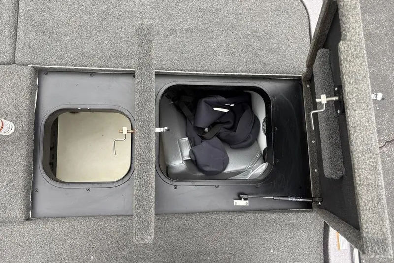 Slide: The Image of Open storage compartments on a 2021 Skeeter ZXR20 boat deck. - 37