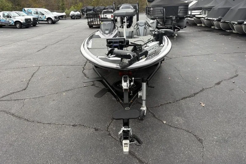 Slide: The Image of 2021 Skeeter ZXR20 fishing boat on trailer in parking lot. - 4
