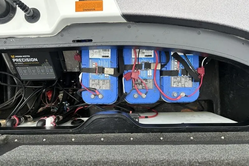 Slide: The Image of 2021 Skeeter ZXR20 boat battery compartment with Minn Kota Precision charger. - 41