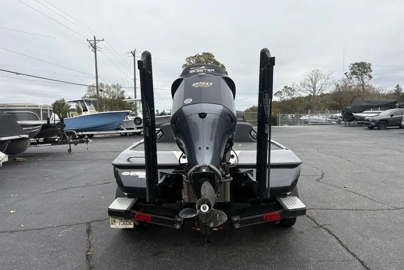 Slide: The Image of 2021 Skeeter ZXR20 boat on trailer, rear view in parking lot. - 6