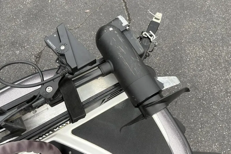 Slide: The Image of 2021 Skeeter ZXR20 boat with Garmin trolling motor on asphalt surface. - 9