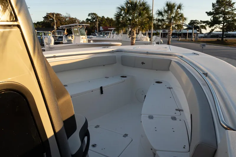 Slide: The Image of 2026 Sea Pro 262 Offshore boat interior with seating and storage compartments. - 14