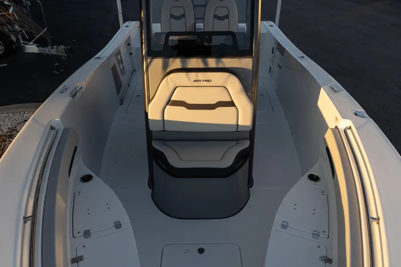 Slide: The Image of 2026 Sea Pro 262 Offshore boat interior with seating and console, viewed from above. - 16