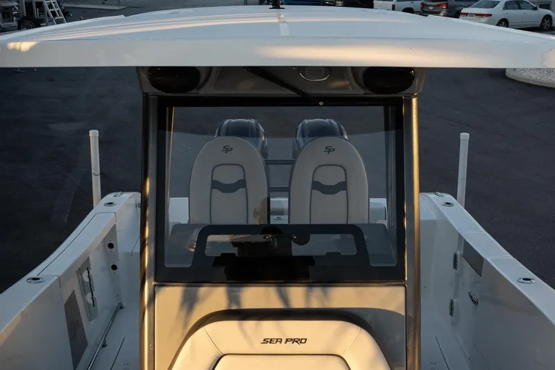 Slide: The Image of 2026 Sea Pro 262 Offshore boat interior with dual seats and console. - 17