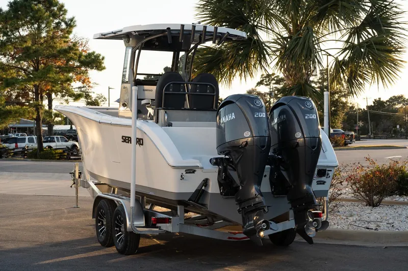 Slide: The Image of 2026 Sea Pro 262 Offshore boat with dual Yamaha engines on a trailer. - 4