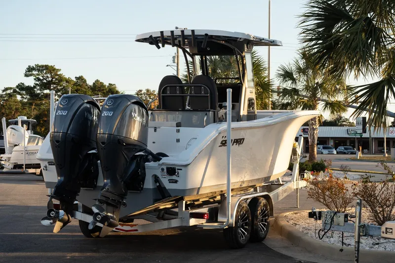 Slide: The Image of 2026 Sea Pro 262 Offshore boat with dual Yamaha engines on a trailer. - 6