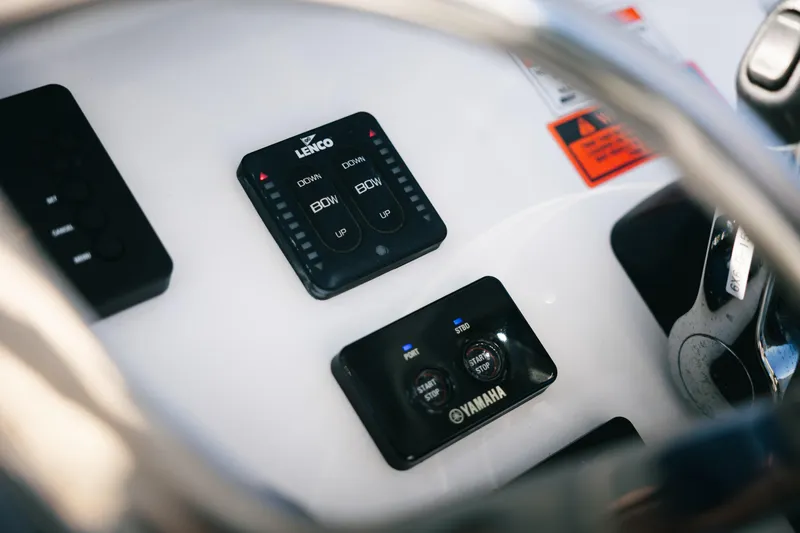 Slide: The Image of Control panel of 2019 Sea Hunt Gamefish 27 Coffin Box boat with Lenco and Yamaha controls. - 11