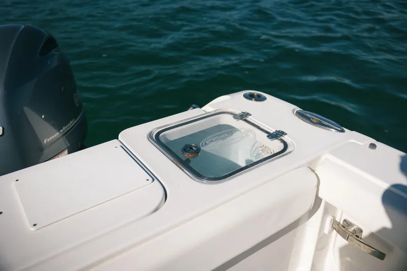 Slide: The Image of 2019 Sea Hunt Gamefish 27 Coffin Box boat detail with ocean backdrop. - 16