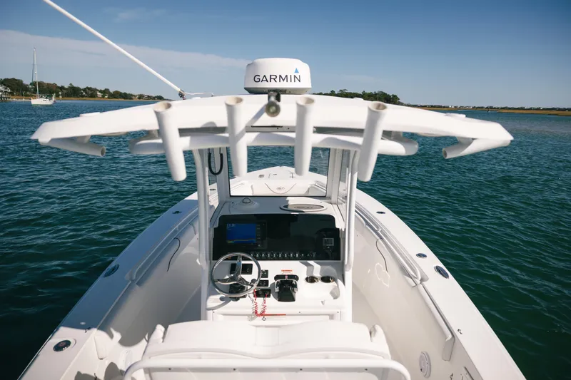 Slide: The Image of 2019 Sea Hunt Gamefish 27 Coffin Box boat with Garmin equipment on open water. - 7