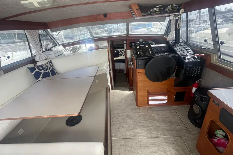 Slide: The Image of Interior of 1983 Bayliner 3888 MY Sedan with helm, seating, and navigation equipment. - 11