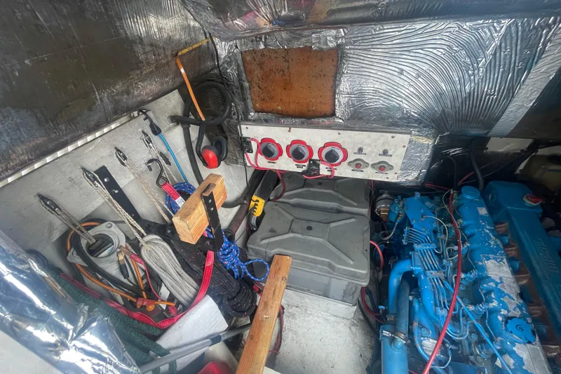 Slide: The Image of Engine room of 1983 Bayliner 3888 MY Sedan with tools and equipment. - 26