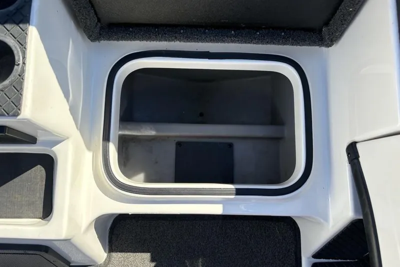 Slide: The Image of 2018 Triton 20 TrX Patriot boat storage compartment, open and empty. - 13