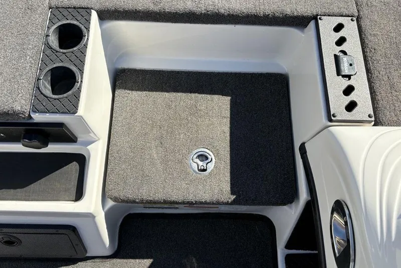 Slide: The Image of 2018 Triton 20 TrX Patriot boat interior with cup holders and storage compartments. - 14