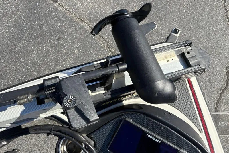 Slide: The Image of Close-up of a 2018 Triton 20 TrX Patriot boat's trolling motor and Lowrance fishfinder. - 17