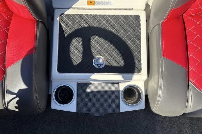 Slide: The Image of Interior of a 2018 Triton 20 TrX Patriot boat with red and gray seats. - 22
