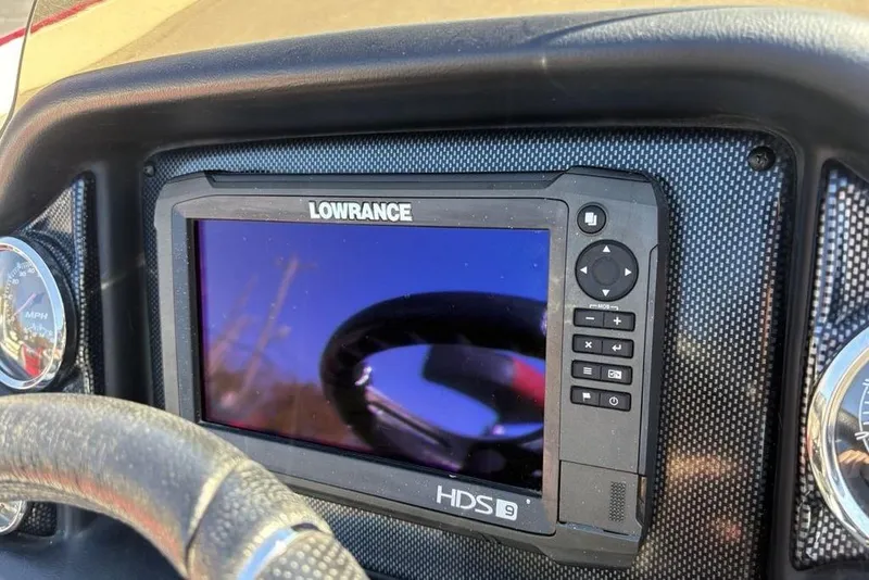 Slide: The Image of Lowrance HDS-9 display on 2018 Triton 20 TrX Patriot dashboard, with speedometer visible. - 27