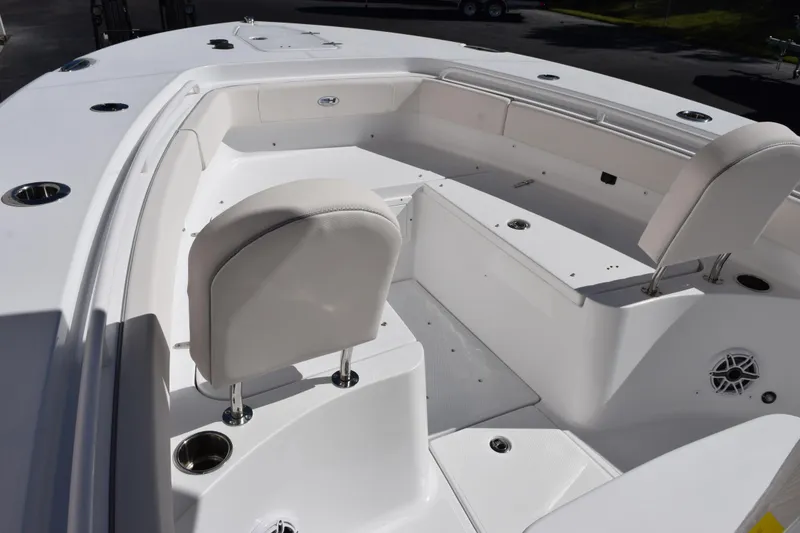Slide: The Image of 2026 Sea Hunt Gamefish 25 boat interior with seating and cup holders. - 12