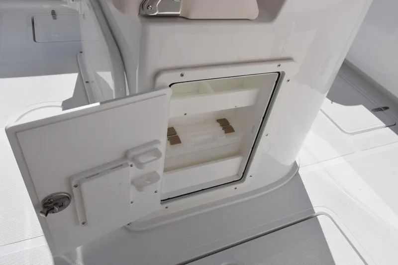 Slide: The Image of Open storage compartment on 2026 Sea Hunt Gamefish 25 boat, showcasing interior space. - 13