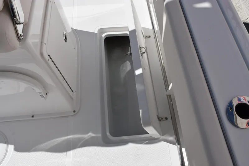 Slide: The Image of 2026 Sea Hunt Gamefish 25 boat storage compartment with open hatch. - 14