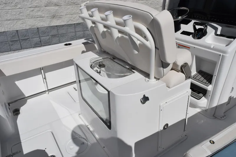 Slide: The Image of 2026 Sea Hunt Gamefish 25 boat interior with seating and control panel. - 8