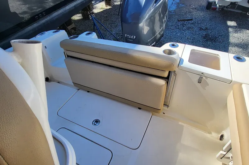 Slide: The Image of 2017 Scout 215 XSF boat interior with foldable seat and Yamaha 150 engine. - 10