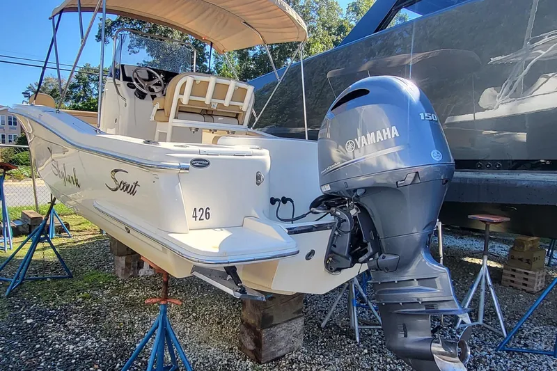 Slide: The Image of 2017 Scout 215 XSF boat with Yamaha 150 engine on stands. - 2