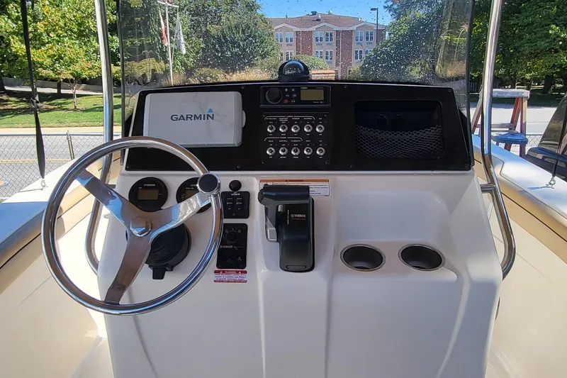 Slide: The Image of 2017 Scout 215 XSF boat dashboard with Garmin navigation and Yamaha controls. - 7