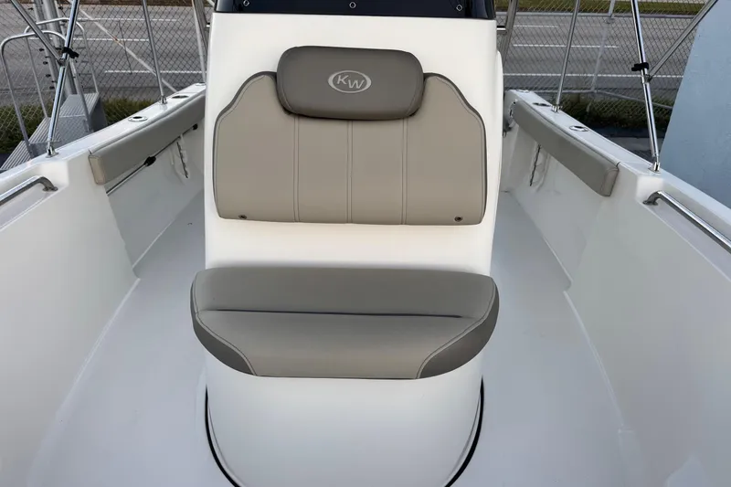 Slide: The Image of 2023 Key West 189 FS boat interior with gray seating and white deck. - 14