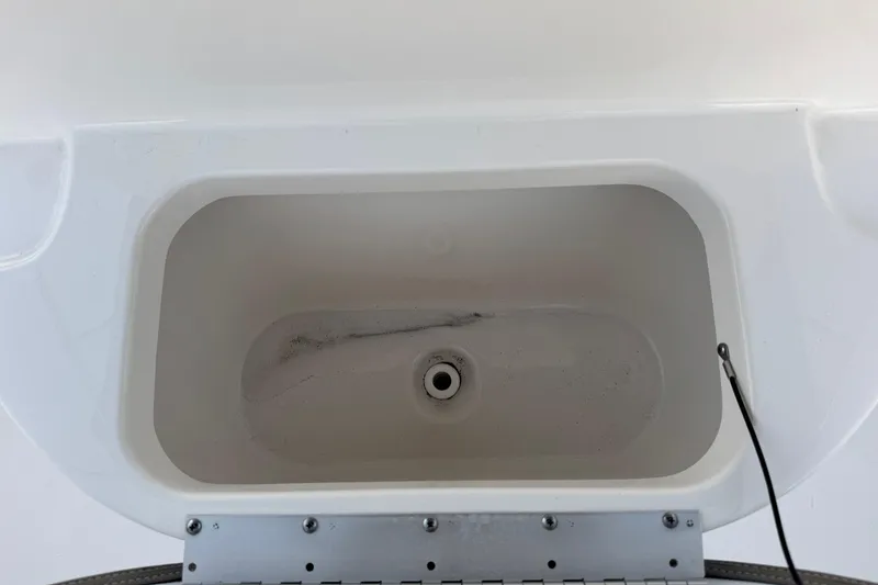 Slide: The Image of 2023 Key West 189 FS boat livewell interior, white and clean design. - 15