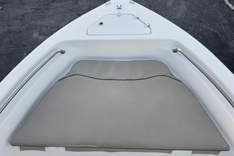 Slide: The Image of 2023 Key West 189 FS boat bow with cushioned seating and stainless steel rails. - 16