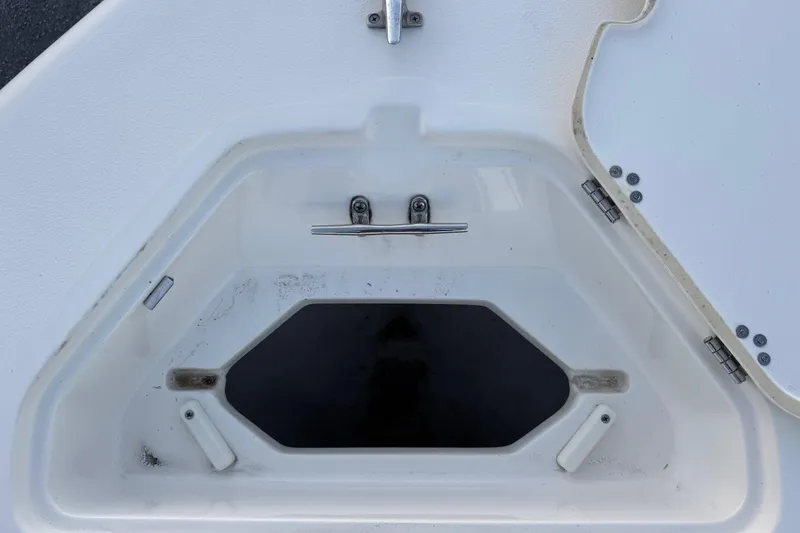 Slide: The Image of 2023 Key West 189 FS boat storage compartment with stainless steel latch and hinges. - 18
