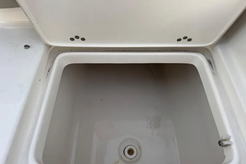 Slide: The Image of Open storage compartment on 2023 Key West 189 FS boat. - 22