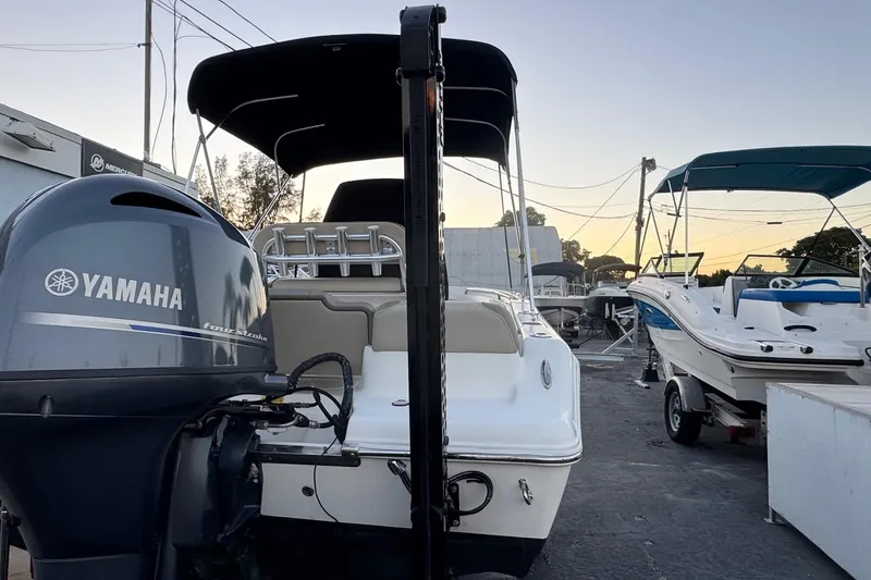 Slide: The Image of 2023 Key West 189 FS boat with Yamaha outboard motor at a marina. - 29