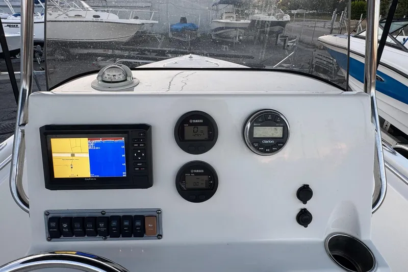 Slide: The Image of 2023 Key West 189 FS boat dashboard with Garmin GPS and Yamaha gauges. - 8