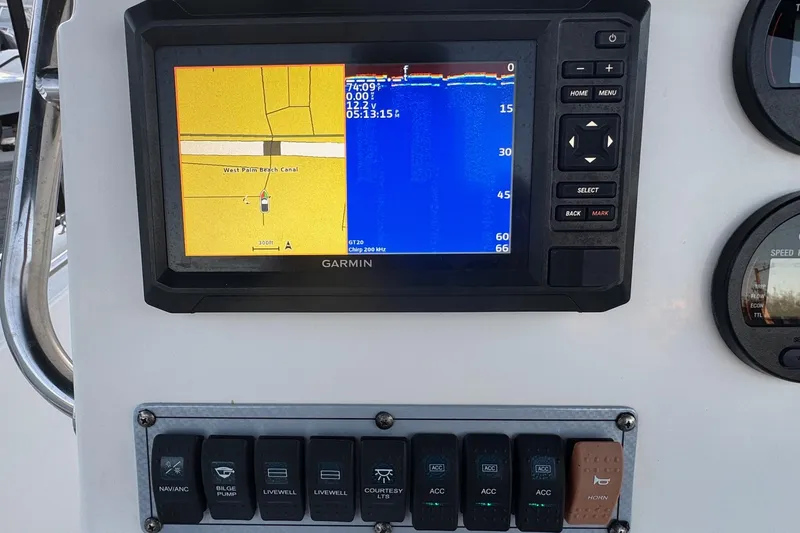 Slide: The Image of Garmin navigation system on 2023 Key West 189 FS boat dashboard, showing West Palm Beach Canal. - 9