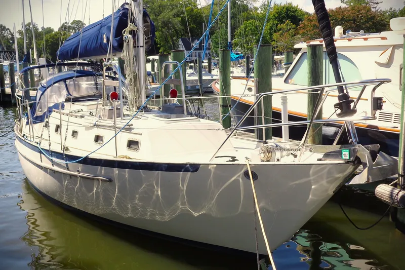 The Image of Sailboat docked at marina, 1992 Pacific Seacraft 34, with blue sail cover. - 0