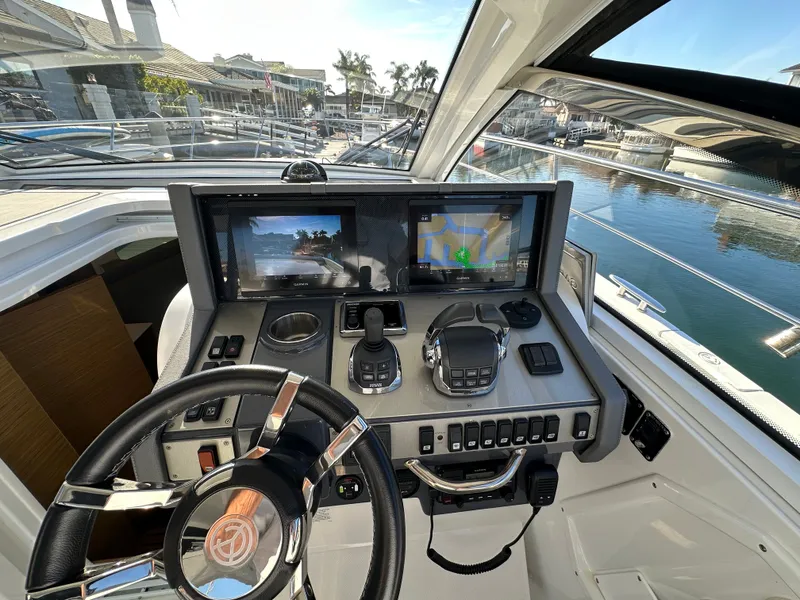 Slide: The Image of Dual Garmin displays and VHF radio and joystick - 11