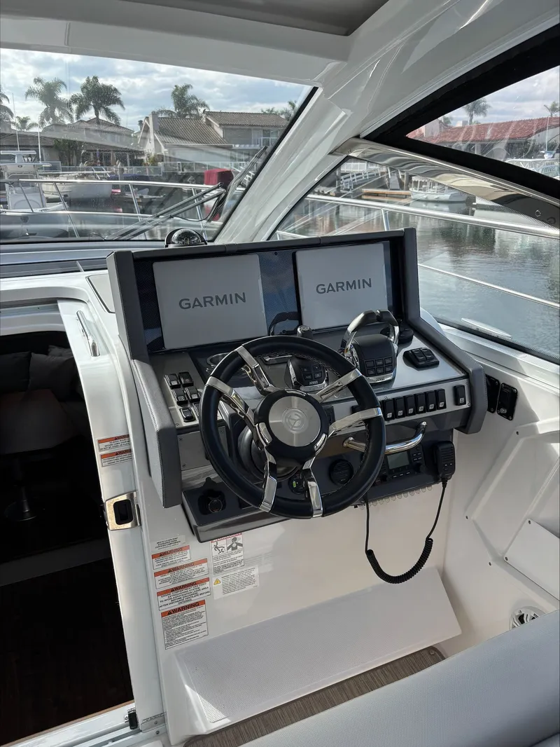 Slide: The Image of Dash board with dual Garmin displays & VHF - 59