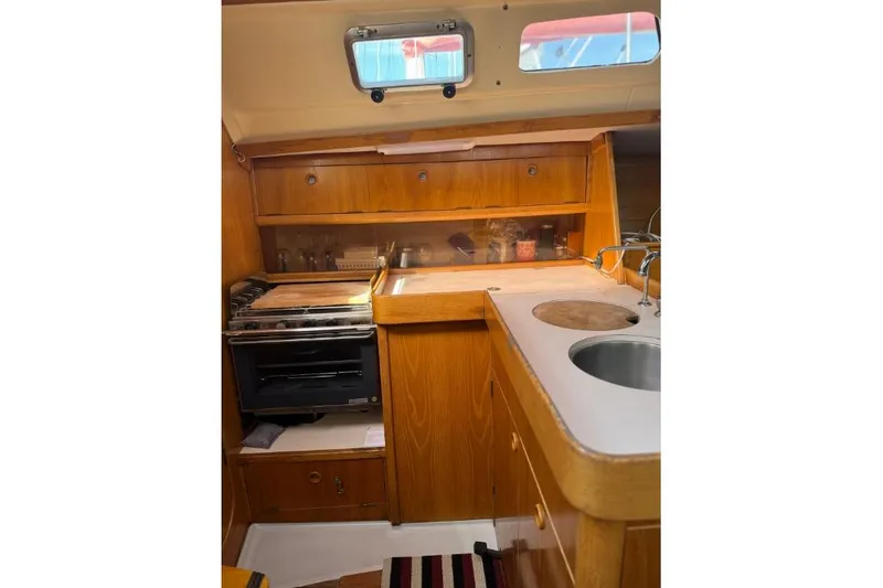 Slide: The Image of 1992 Beneteau Oceanis 350 sailboat deck view in marina setting. - 13