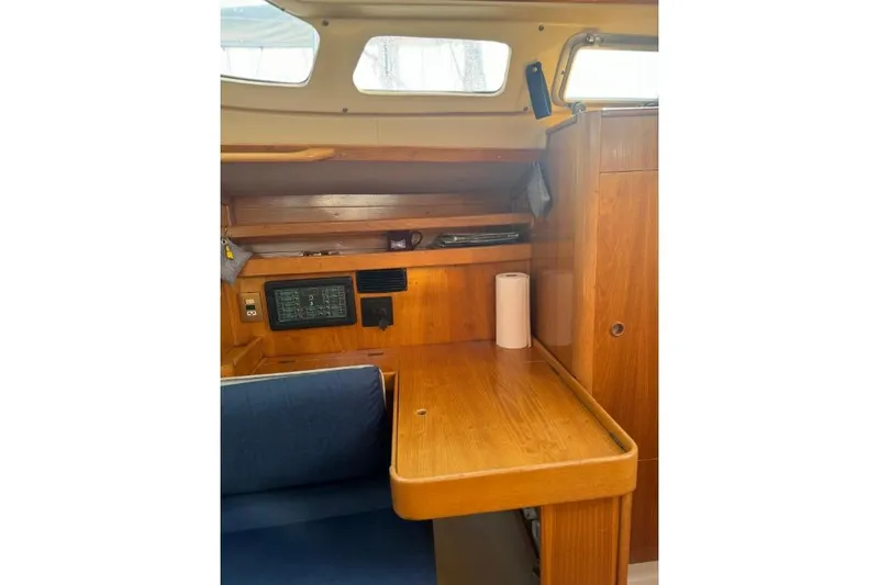 Slide: The Image of Interior of 1992 Beneteau Oceanis 350 yacht kitchen with wood cabinetry and appliances. - 14